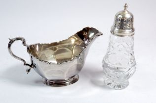 A cut glass & silver sugar sifter, Birmingham 1966 by Elkington & Co and a silver sauce boat,