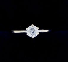 An 18 carat gold solitaire diamond ring, size I to J, 2.2g