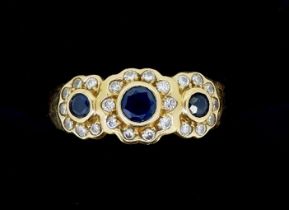 An 18 carat gold ring set triple sapphire and diamond cluster, size N, 4.4g