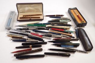 A large collection of various vintage fountain pens, biros and pencils including Parker 45,