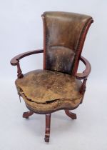 An early 20th century Irish swivel desk chair, the mahogany arms with marquetry decoration, all