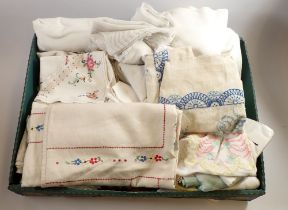 A box of vintage table linen including some good embroidered table clothes etc.