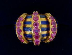 A 14k gold vintage style domed ring set bands of blue enamel and three rows of rubies, size L to M