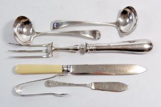 A small group of silver plated cutlery including carving fork