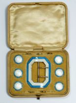 A silver and turquoise enamel button and buckle set, the buckle marked Birmingham 1911, by Levi &