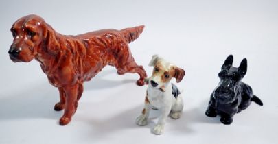 A Royal Doulton Red Setter, 13.5cm tall, a sitting Jack Russell and a Scottie, 9cm each (3)