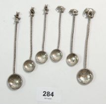 Six Indian white metal small spoons with animal terminals and coin bowl