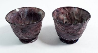 A pair of Victorian press moulded slag glass footed bowls, 8cm tall