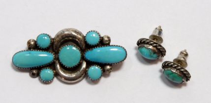 An Indian white metal and turquoise brooch and earrings