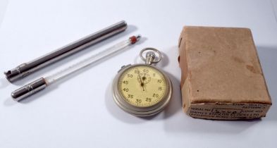 A military stop watch and a 1930's thermometer