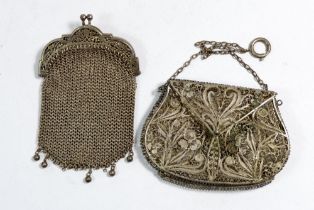 A silver chain coin purse and a filligree purse