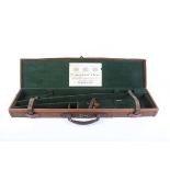 A canvas and leather gun case with green baize lined interior fitted for 30 ins barrels, Stephen