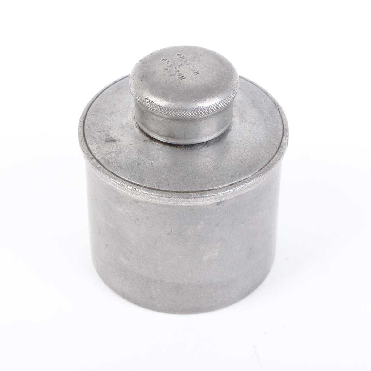A pewter oil bottle by Holland & Holland