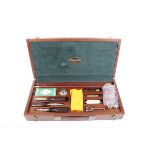 An unused Parker Hale 12 bore cleaning kit comprising two-piece brass mounted cleaning rod and