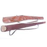 A good fleece lined leather gun slip, together with a canvas and leather gun slip by Quality