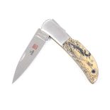 A special edition Al-Mar pocket knife by Sam McDowell 'Buffleheads' scrimshaw dated 1987, as new,