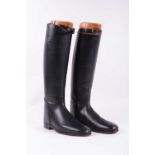 A pair of black leather riding boots by Hawkins (Northampton), size 10, with wooden Tom Hill,