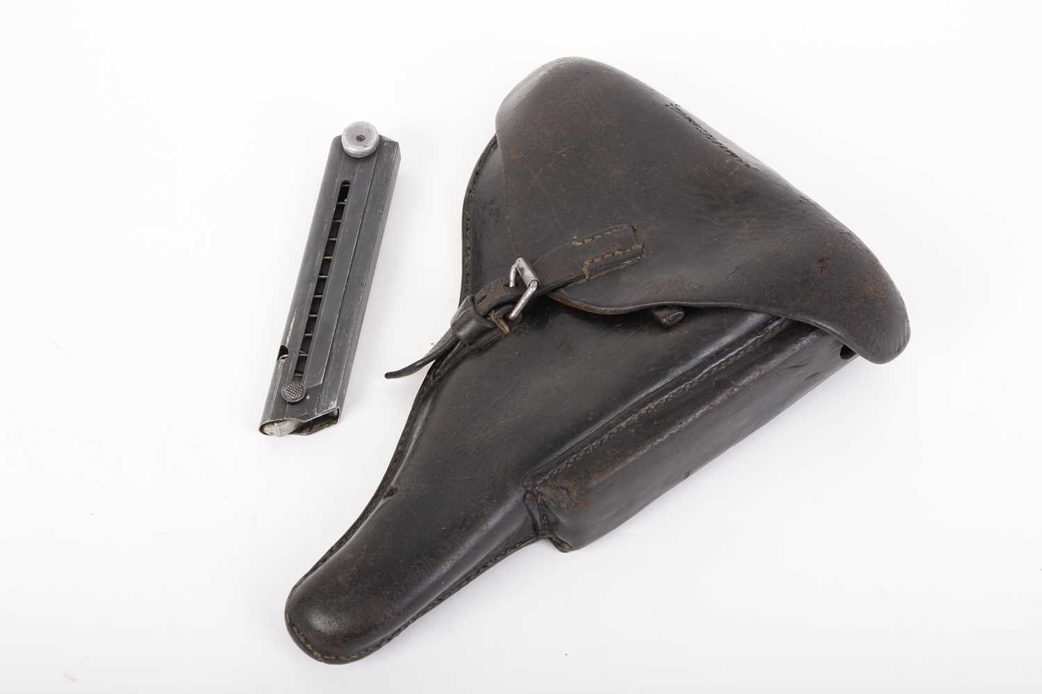 A 1938 Luger P08 leather holster marked '1938 WaA94 ' & 'Lederwarenwerk Curt Vogel Cottbus' and