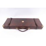 Oak and leather double gun case, brass corners, with vacant brass disc, red baize-lined fitted