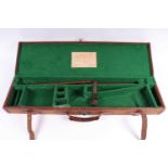 A canvas and leather gun case with green baize re-lined interior for 29 ins barrels (would take up