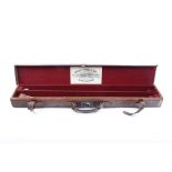 Canvas and leather double barrel case with red baize lined fitted interior for 29 ins barrels,