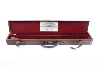 Canvas and leather double barrel case with red baize lined fitted interior for 29 ins barrels,