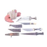 Four eastern knives: Yemeni Jambiya with 9 ins blade, in leather scabbard with attached belt, two
