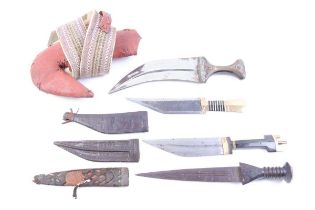 Four eastern knives: Yemeni Jambiya with 9 ins blade, in leather scabbard with attached belt, two