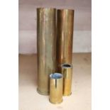 Two WWI German brass shell cases dated February and July 1917, together with two No.10 Mk 3 engine