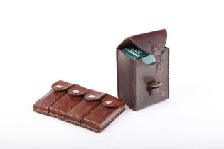 Set of four leather belt pouches with Mauser stripper clips; leather belt box cartridge pouch