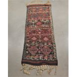 A half van kilim wool on wool rug, early 20th century, signed tassel fringes, 210cm x 77cm