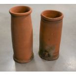 Two antique terracotta chimney pots, of varying sizes, 78cm & 69cm high, with varying degrees of