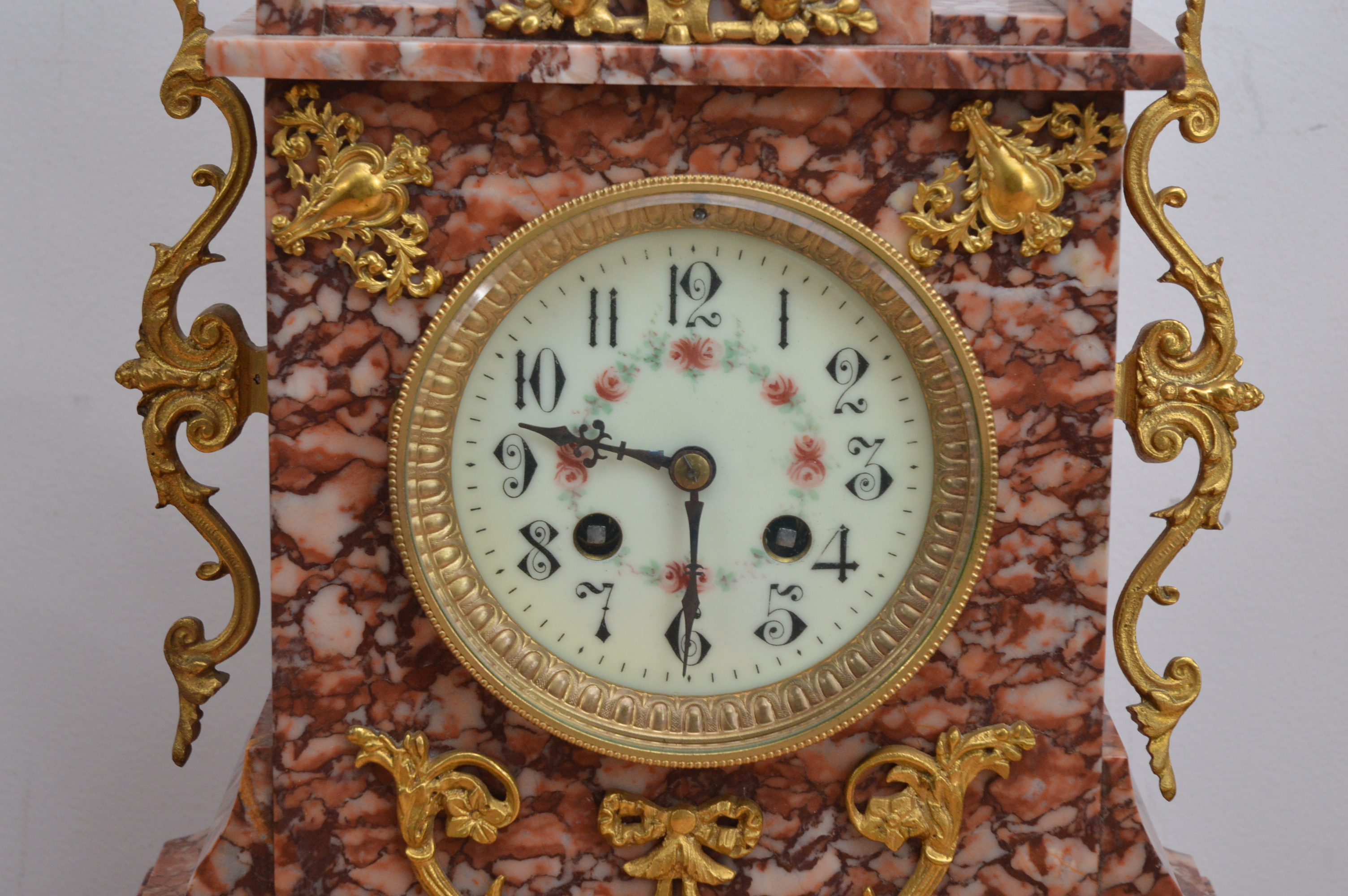 A late 19th century and later French red marble mantle clock garniture, the dial with Arabic - Image 2 of 4