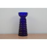 A George III Bristol blue glass bullseye vase, ribbed' exterior with heightened gilt work, some