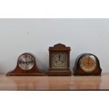 Three wooden cased mantel clocks, two 'Napoleon Hat style', all untested the tallest, 33cm high