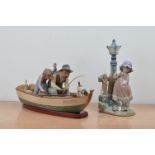 Two Lladro ceramic figural groups, comprising a father, son and dog on a fishing boat, with a wooden
