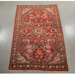 A wool on cotton rug, Persian style, floral design, some wear, AF, 198cm x 130cm