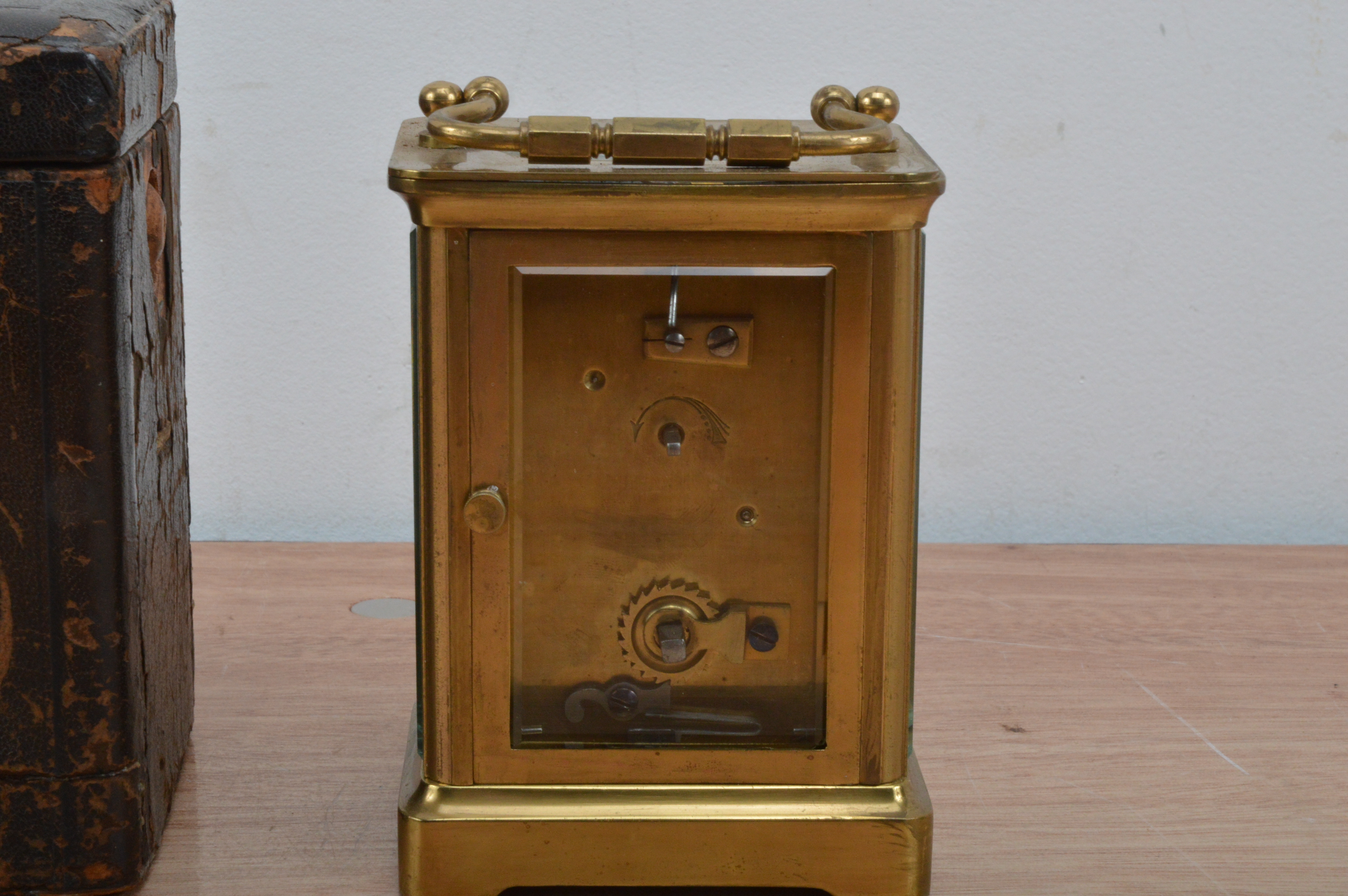 An early 20th century brass carriage clock, enamel dial with roman numerals, total height 12cm, with - Image 2 of 2