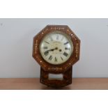 A 19th century wall clock, the dial with Roman numerals, retailed by Rombach Bro's of Old Kent Road,