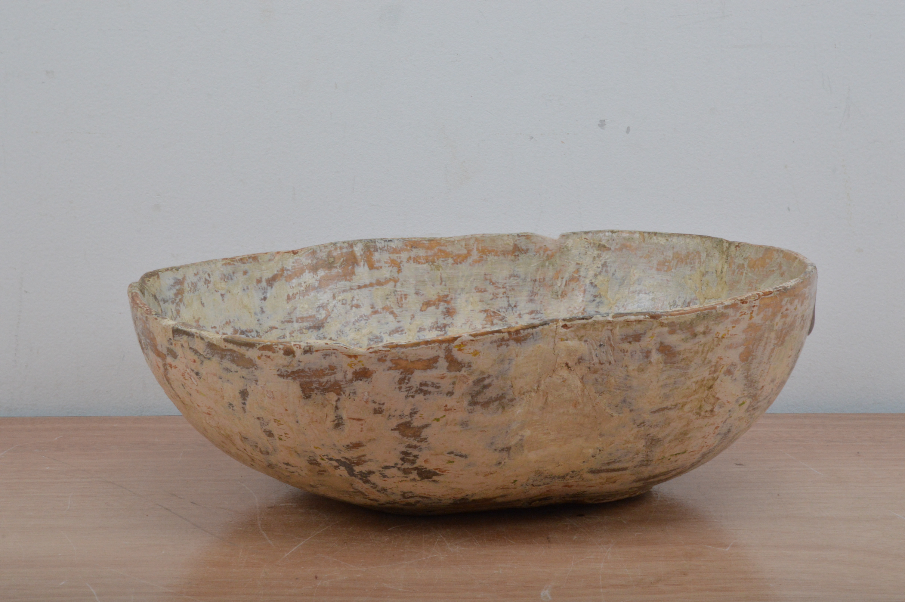 A late 18th century Swedish primitive wooden bowl, oval shape, part painted, with a staple repair,