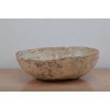 A late 18th century Swedish primitive wooden bowl, oval shape, part painted, with a staple repair,