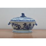 A Chinese ceramic twin handled tureen and cover, transferware design, the body cracked and repaired,