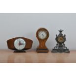 Three clocks, of differing styles, on a mahogany cased classical style mantle clock, the dial with