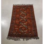 A middle eastern wool on wool rug, red, yellow and blue geometric design, flat weave ends, 193cm x