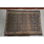 Two antique carpets, both with geometric designs, differing in size and with wear, 165cm x 102cm &