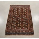 A Turk tekke style wool on wool rug, brown geometric design, fringes, 163cm x 105cm