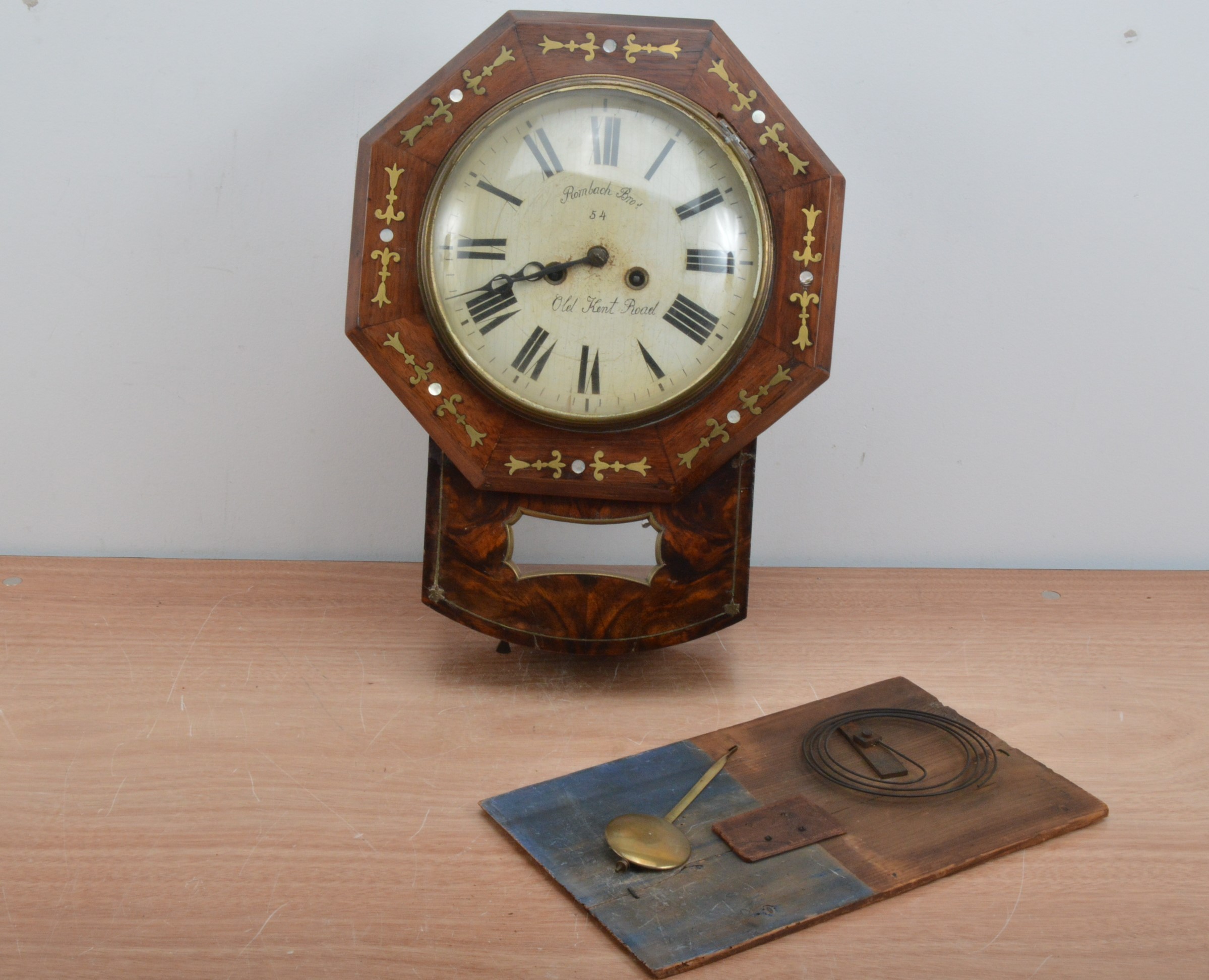 A 19th century wall clock, the dial with Roman numerals, retailed by Rombach Bro's of Old Kent Road, - Image 2 of 3