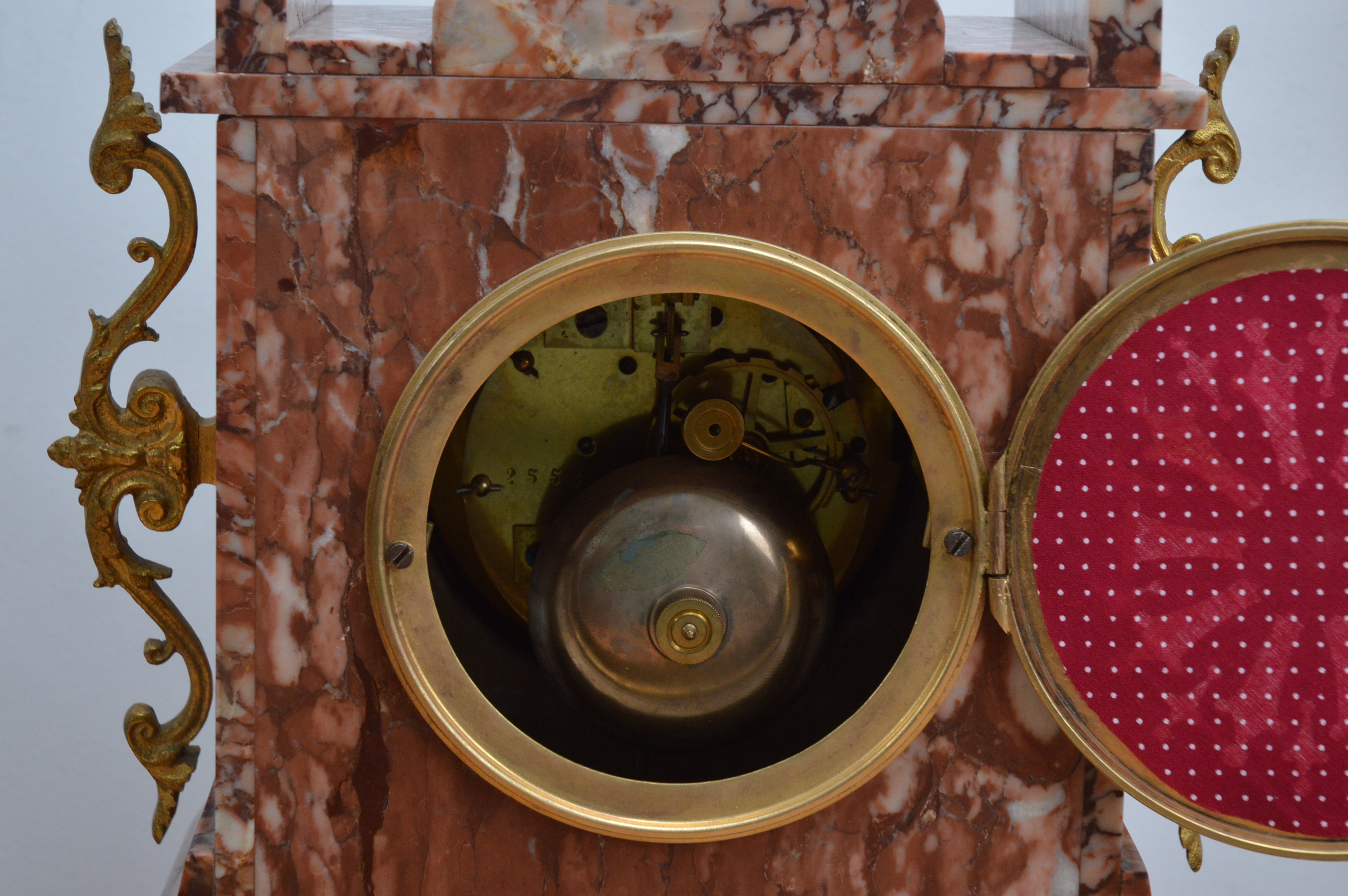 A late 19th century and later French red marble mantle clock garniture, the dial with Arabic - Image 4 of 4