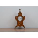 A Burr walnut and metal mounted mantel clock, the enamel dial with Roman numerals, cracked and