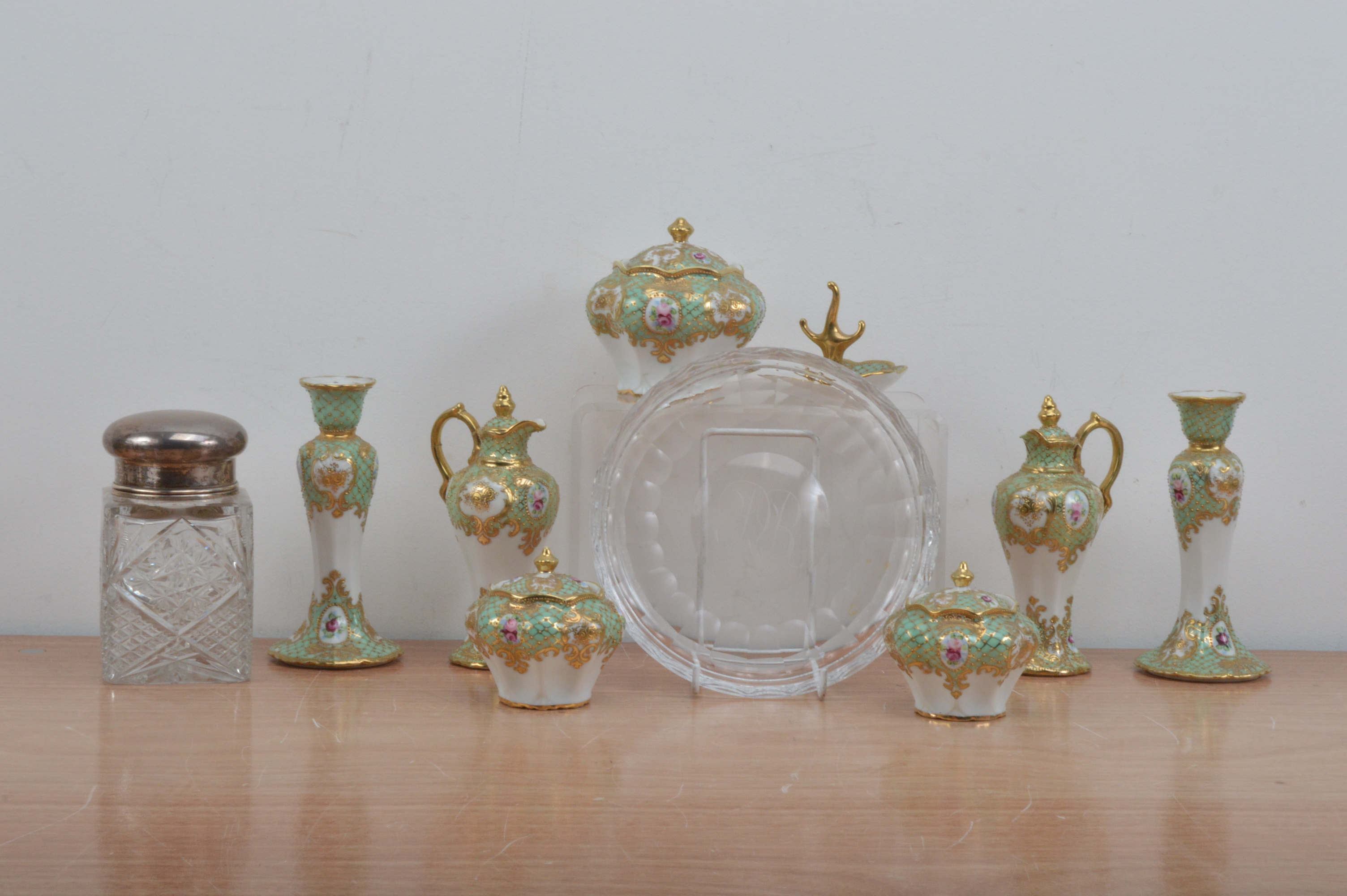 A collection of Noritake dressing table china items, green and white with heightened gilt,